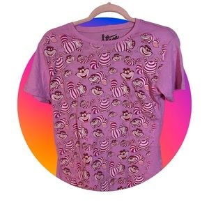 A cute pink top with the Cheshire Cat print throughout in a size large